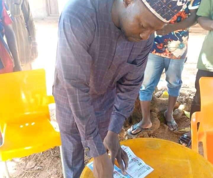 Ex-Nasarawa health Commissioner Pharm. Ahmed Baba Yahaya thumb print his ballot papers during the LG election in Toto