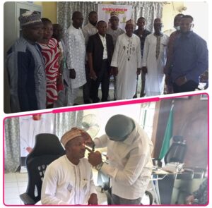 chairman of the NGO, Dr. Baribiae  Nyieyete administering eye test on the Executive Chairman of Toto LG, Hon. Aliyu Abdullahi Tashas in his office on Monday