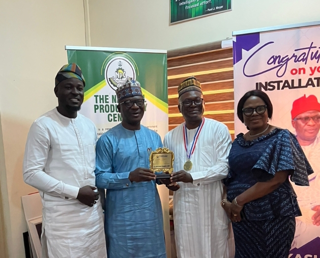 Second Right Dr Nasir Mustapha Raji, Director of Procurement, National Productivity Center NPC, flanked by the Director General, National Productivity Center NPC, Dr Chief Kashim Akor during the presentation of the Award.