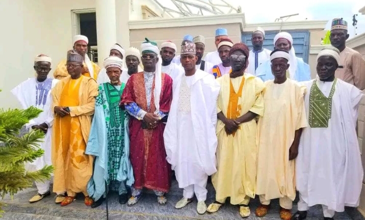 House of representatives member for Abuja south federal constituency Alhaji Abdulrahman Ajiya (m) in a group photograph with village chiefs after they paid him a sallah homage at his residence in Abaji on Friday