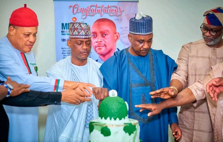 Speaker of the house of representatives, Hon Tajudeen Abbass, (m) Abuja south lawmaker, Hon Abdulrahman Ajiya second left and his colleagues as they cut the cake to mark 53rf birthday of Ajiya, in his office in Abuja on Tuesday.