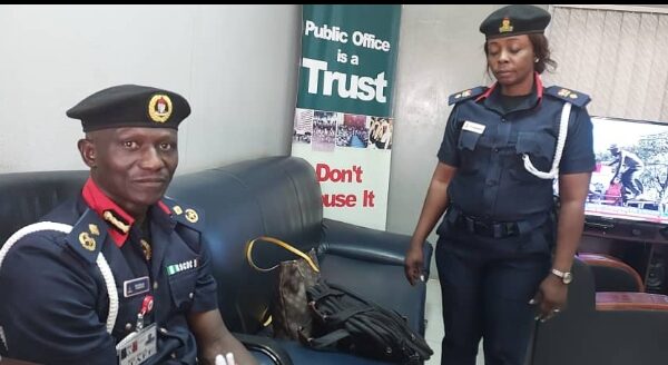 R-L: NSCDC Mrs Olagunju Comfort Tosin standing in front of NSCDC Provost who took her to Code of Conduct Bureau (CCB) for questioning over Job racketeering and alleged N12.4m fraud, recently.