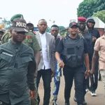 Honorable Ameh Williams, the Transition Committee Chairman of Olamaboro Local Government Area of Kogi State and other security agents during a show of force