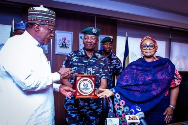 The two Ministers of Police Affairs, Senator Ibrahim Geidam and Hajiya Imaan Suleiman -Ibrahim in a photograph with Inspector General of Police