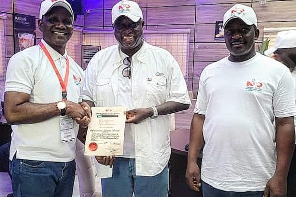 Fellow, Nigerian Institute of Public Relations, NIPR, Elder Emma Ogidi (2nd right) presenting certificate of participation to the Director General, Delta State Orientation and Communications Bureau, Fred Latimore Oghenesivbe Esq (1st left) while NIPR Vice President, Prof Emmanuel Dandaura watches with keen interest at the just concluded Directors Conference/Retreat of the Institute in Asaba, Delta State capital.