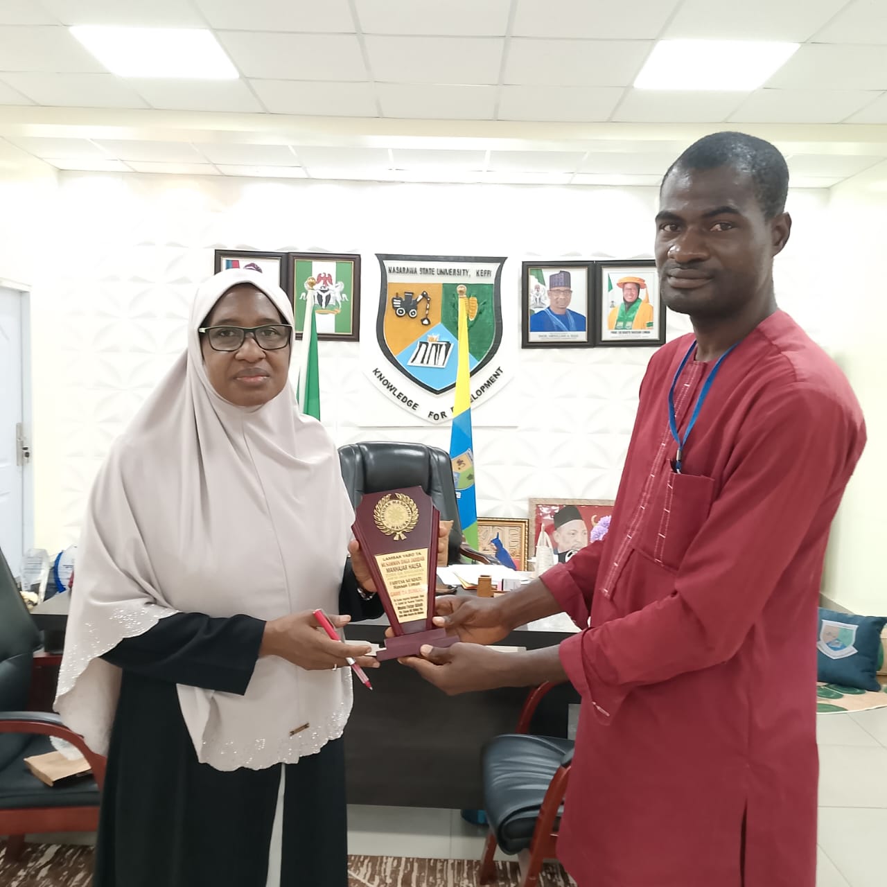 Vice Chancellor of the Nasarawa State University Keffi, Prof. Sa'adatu Hassan Liman and John Dogo Wada, correspondent for Nasarawa state at the well-known national print media outlet Blueprint Hausa version (Manhaja)