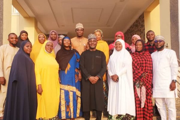 Dr. Musa Muhammed Maikaya in a group photograph with Toto Women Development Association