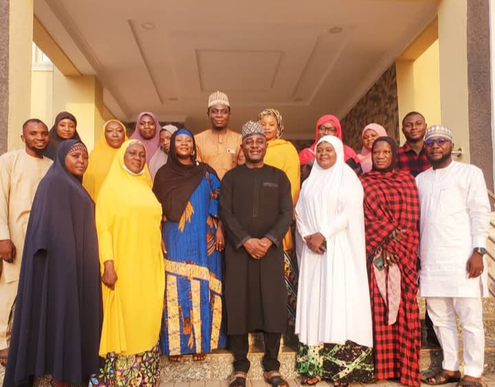 Dr. Musa Muhammed Maikaya in a group photograph with Toto Women Development Association