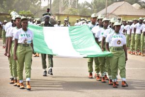 Corps members marching parade guards 