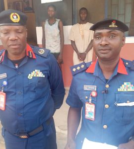 The public Relations officer NSCDC Nasarawa state command, DSC Jerry Victor with the Keffi area commander of the NSCDC while parade the suspects along Nasarawa road Keffi