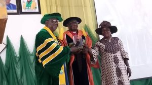 Prof. Sallau Moddibo, the representative of VC Presenting a plaque to the inaugural lecturer.