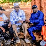 Hon. Engineer Muhammed Abubakar Bashir Gegu, the Kogi State Commissioner for Solid Minerals and Natural Resources and a chieftain of the All Progressives Congress (APC) in group picture with people with disability shortly after being honoured in Gegu Beki. Photo credit: Joseph Kpanaki
