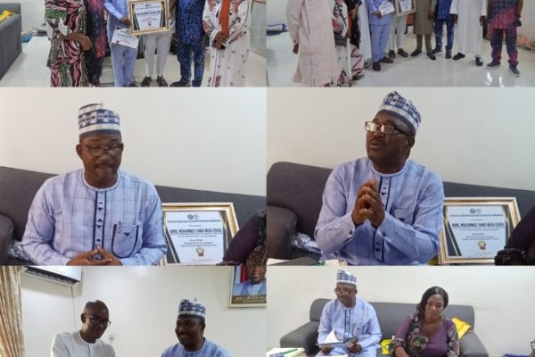 Hon. Barr. Muhammed Tanko Musa (Osuku), the Executive Chairman of Kogi State Civil Service Commission receiving award for his remarkable congratulations to development of Kogi State