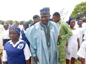 Pharm. Ahmed Baba Yahaya, Executive Chairman, Toto LGA exchanging pleasantry with Primary school pupils during children's day