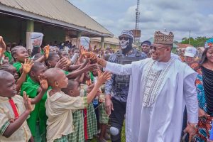 Hon. Comr Ameh Williams, the Executive Chairman of Olamaboro Local Government Area of Kogi State and pupils 