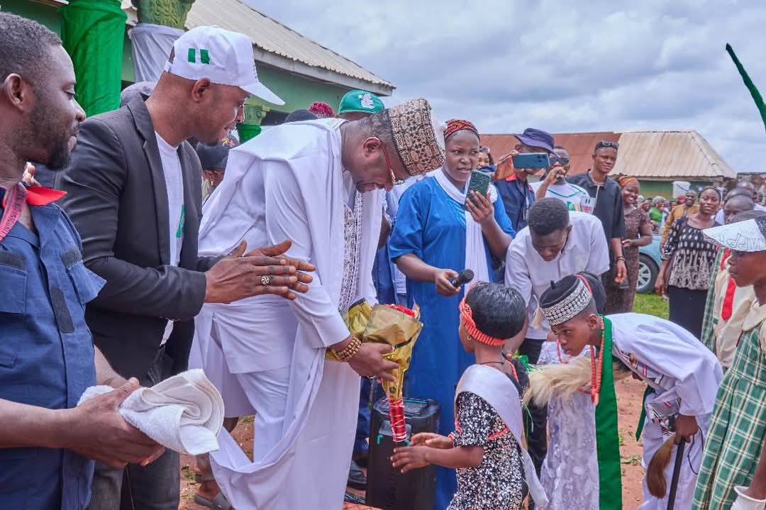 Hon. Comr Ameh Williams, the Executive Chairman of Olamaboro Local Government Area of Kogi State and pupils