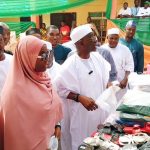 Wadada while inspecting crafted work by students of EDC.