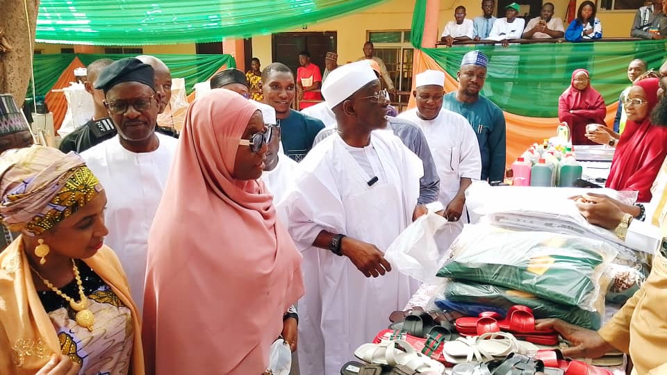 Wadada while inspecting crafted work by students of EDC.