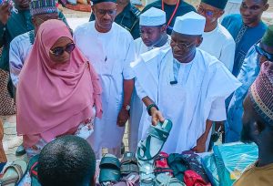 Sen. Wadada with director of EDC Prof. Funke during the visit to the center.