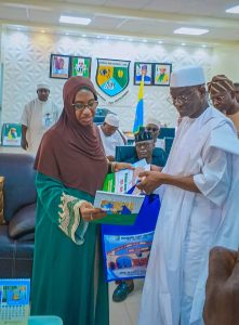 Senator Wadada receiving action plan documents from the VC -NSUK. Prof. Sa'adatu Hassan Liman, during the visit.