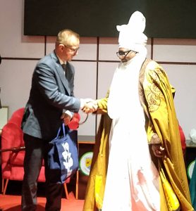 The Chancellor to the University, HRH. Alh. Dr. Shehu Chindo Yamusa 111, CONPresenting an Award of Recognition to the Ambassador of the Republic of Poland To Nigeria, Ambassador Michal Cygan.