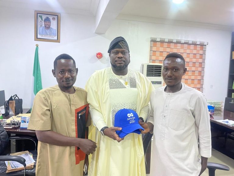 Deputy Executive Secretary, Universal Basic Education Commission (UBEC), Mr Tunde Segun Ajibulu, (mni) receiving campaign materials from youth leaders