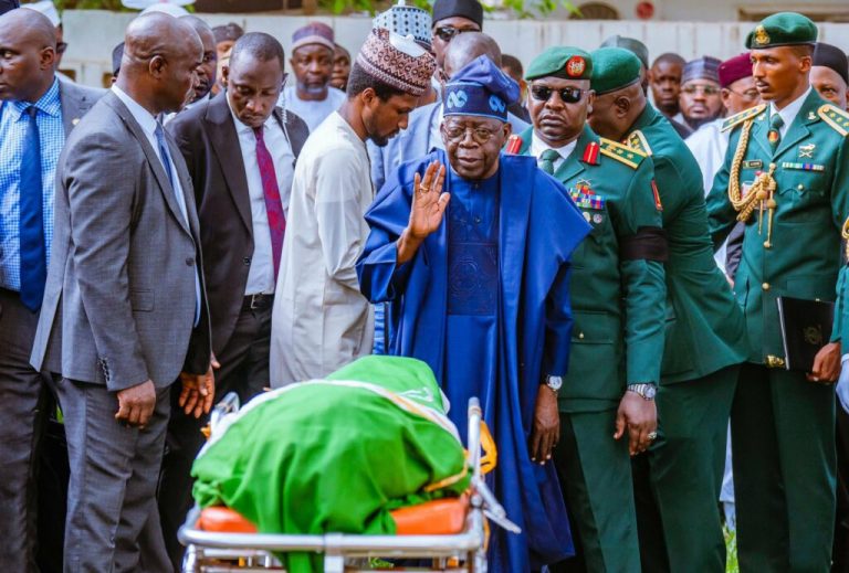 President Bola Ahmed Tinubu honouring late President Muhammadu Buhari during is burial rite in Daura, Katsina State
