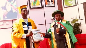 Dr. Abdullahi Ibrahim while receiving fellowship award by director research institute.