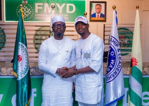 Minister of Youth Development, Hon. Olawande Emmanuel Ayodele (L) and Comrade Abdulrahman Abdulmumuni Enesi, the Kogi State Chapter Chairman of the National Youth Council of Nigeria, NYCN.