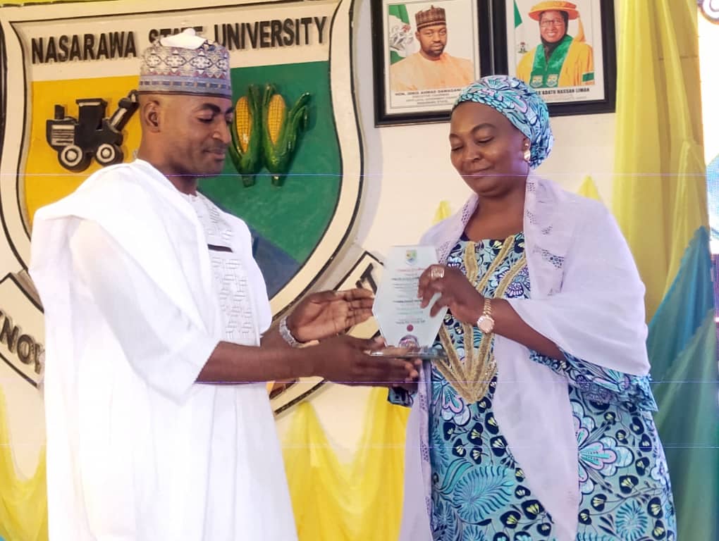 Amb. Alewa Akawu Nasiru, receiving an award from the VC of NSUk