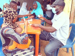 Medical personnel attending to patient at Wadada's free medical outreach.