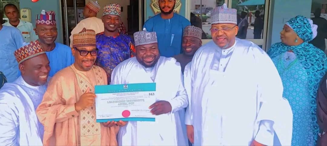 Chairman/Board of Trustee (BOT) of the Kuje Leadership University Dr Aliyu Modibbo Umar right, Pro -Chancellor of the University, Dr Musa Yahaya Muhammad and Prof Muhammed Evitu display licence approved by the NUC to commence academic activities at the institution.