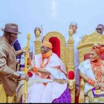 Delta State Governor, Rt. Hon. Sheriff Oborevwori standing while the Asagba of Asaba, His Royal Majesty Obi (Prof.) Epiphany Chigbogu Azinge is seated with his wife