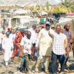 The Gwagwalada PDP chairmanship candidate Hon Mohammed Kasim Ikwa being conducted round the spare parts market on Monday, that was gutted gutted by fire on Saturday in Zuba.