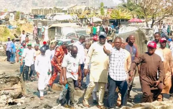 The Gwagwalada PDP chairmanship candidate Hon Mohammed Kasim Ikwa being conducted round the spare parts market on Monday, that was gutted gutted by fire on Saturday in Zuba.