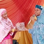 The commissioner for finance, Hajiya Munira Abdullahi, receiving the award on behalf of Governor Abdullahi Sule.