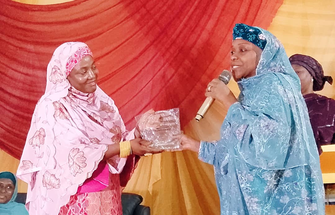 The commissioner for finance, Hajiya Munira Abdullahi, receiving the award on behalf of Governor Abdullahi Sule.