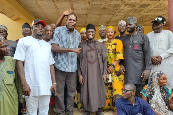 Hon. Joseph Kaura together with his supporters in a group photograph.