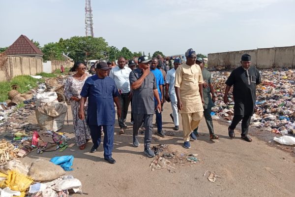 Chairman of Kuje Area Council Hon Samuel Danjuma Shekwolo with environmental officials during inspection of waste evacuation in Kuje on Friday.