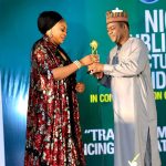 Kogi State Coordinator of the Agro-Climatic Resilience in Semi-Arid Landscapes (ACReSAL) project, Ladi Ahmed Jatto receiving her award