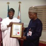 Former governor of Osun State and National Secretary of the African Democratic Congress (ADC), Ogbeni Rauf Aregbesola (L) and Former Commissioner for Information in Kogi State, Hon..Tom Ohikere (R)