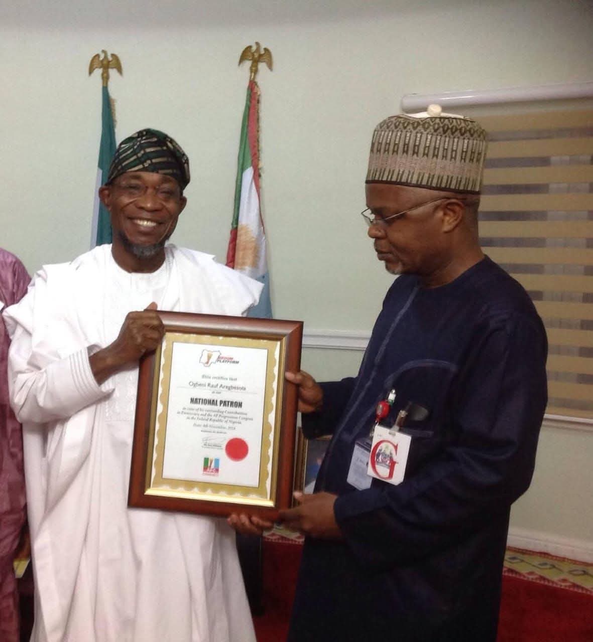 Former governor of Osun State and National Secretary of the African Democratic Congress (ADC), Ogbeni Rauf Aregbesola (L) and Former Commissioner for Information in Kogi State, Hon..Tom Ohikere (R)