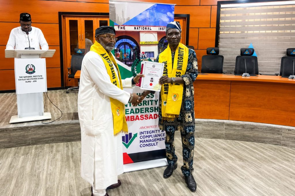 Chairman of the Delta State Independent Electoral Commission (DSIEC), Sir Dr Jerry Agbaike receiving his award