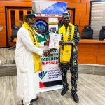 Chairman of the Delta State Independent Electoral Commission (DSIEC), Sir Dr Jerry Agbaike receiving his award