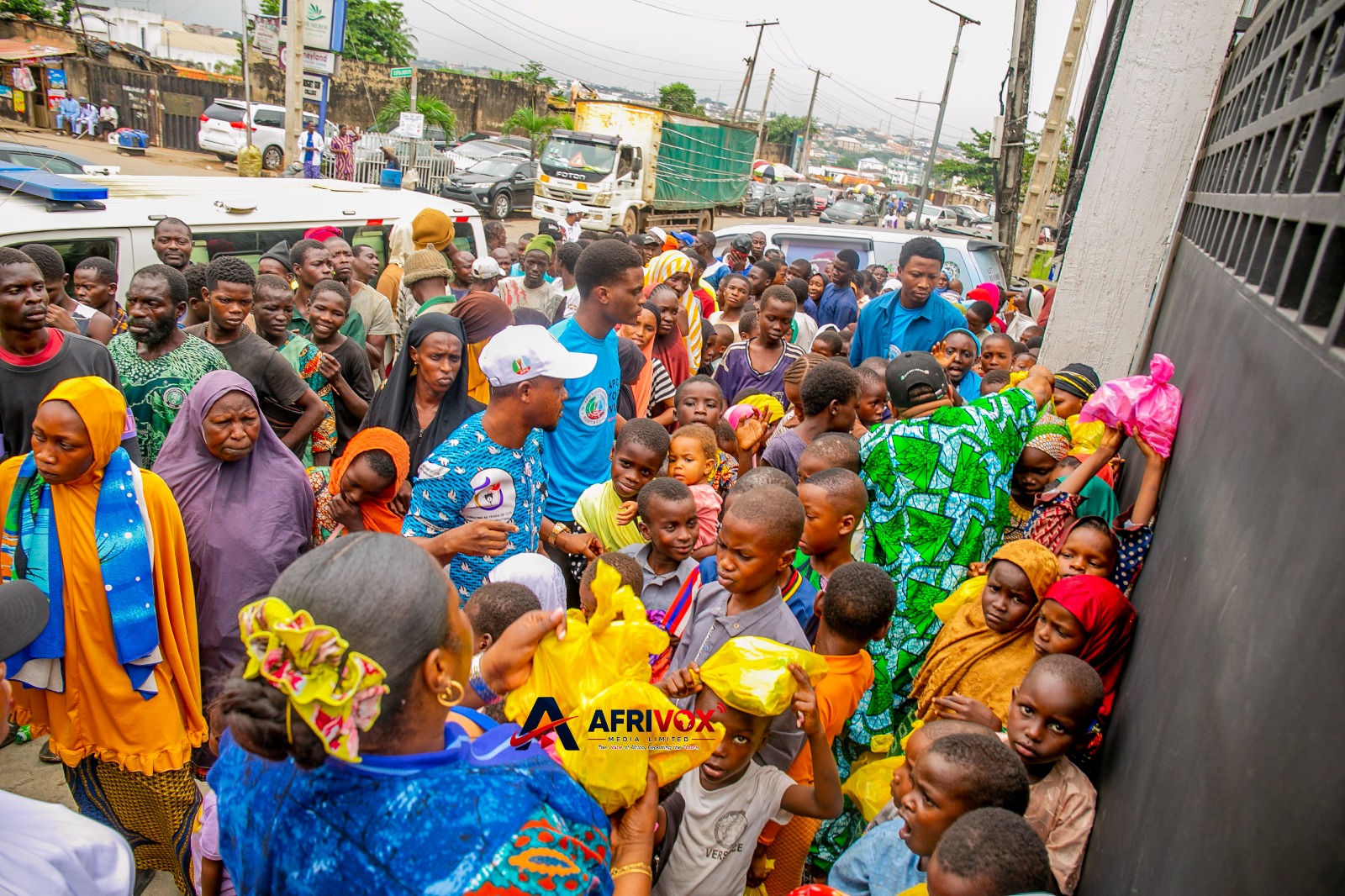Beneficiaries receiving meals during APC Youth Network West Africa's weekly food outreach in Lagos.