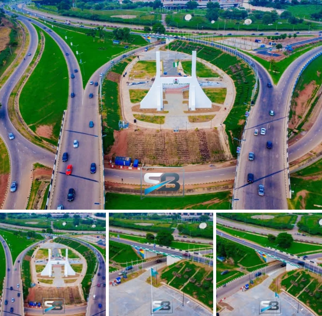 The renovated Abuja City Gate illuminated at night following its remodelling under FCT Minister Nyesom Wike.