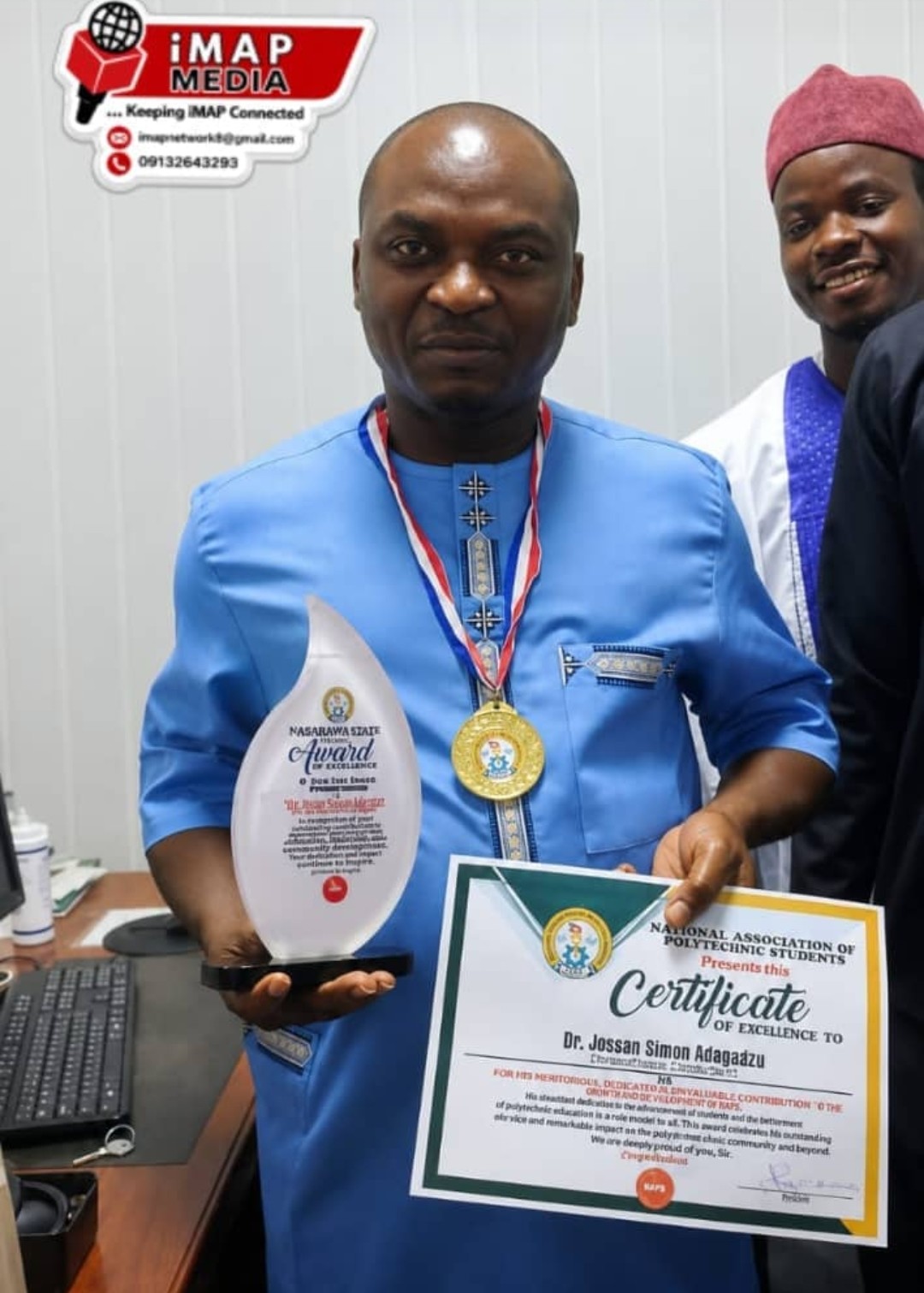 Dr Joseph Simon Adagadzu receiving NAPS Award of Credence in Abuja