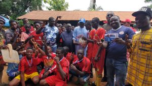 CEO of Oveysha foundation together with the winners of Oveysha grassroot football competition.