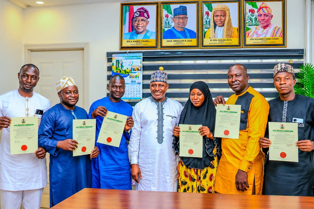Hon. Mohammed Garba Isimbabi presents appointment letters to beneficiaries as he secures six fresh permanent and pensionable jobs for Toto/Gadabuke constituents in Nasarawa State.